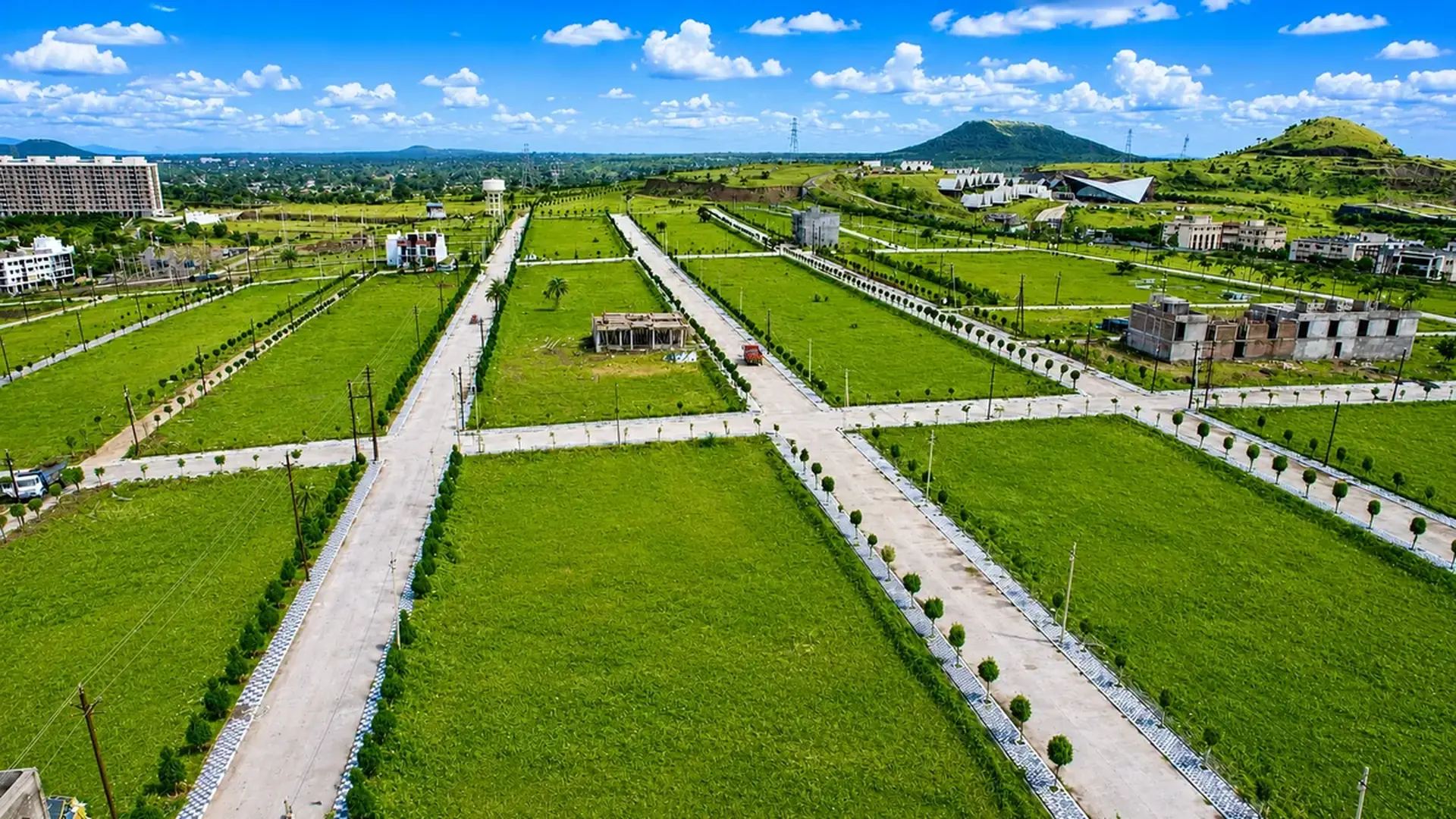 Aerial view of green plotted roads and open land at Chinar Hills